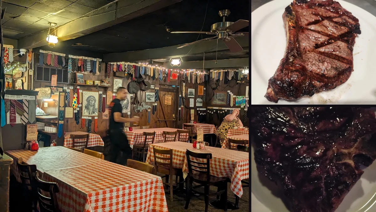 Rustic steakhouse dining room with simple wooden tables.